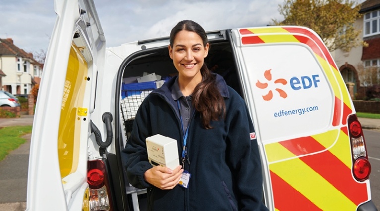 EDF engineer standing in front of van ready to install a smart meter 