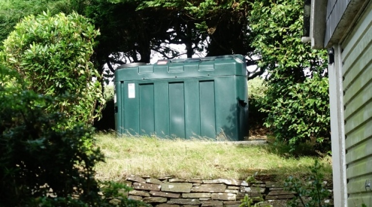 domestic heating oil storage tank in a garden
