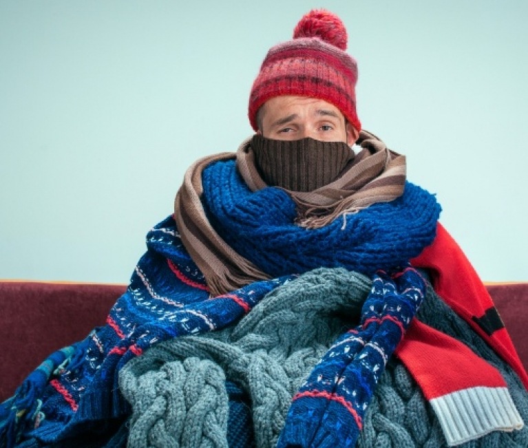 man in cold home with broken heating