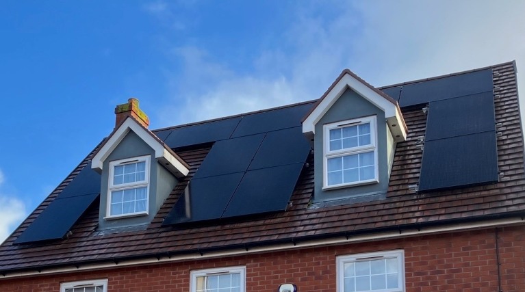Detached home with solar panels installed on roof